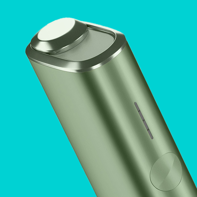 An IQOS ILUMA PRIME Holder with a TEREA stick inserted next to an IQOS ILUMA Pocket Charger.