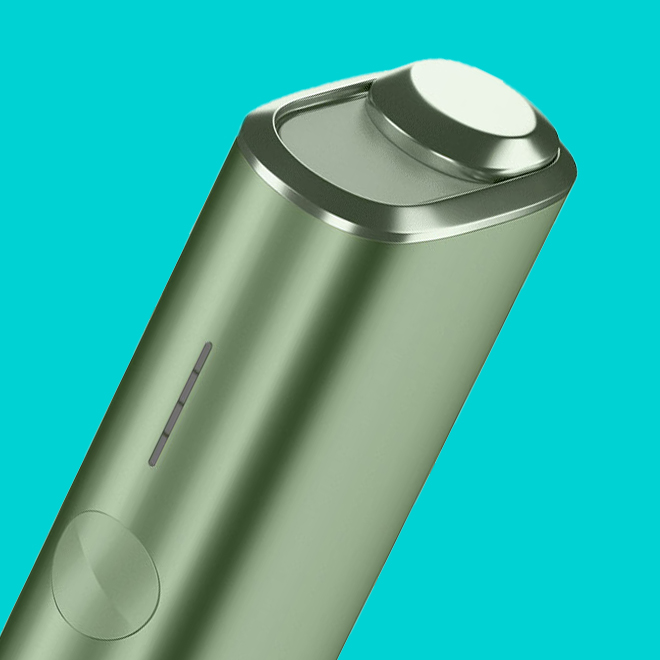 An IQOS ILUMA PRIME Holder with a TEREA stick inserted next to an IQOS ILUMA Pocket Charger.