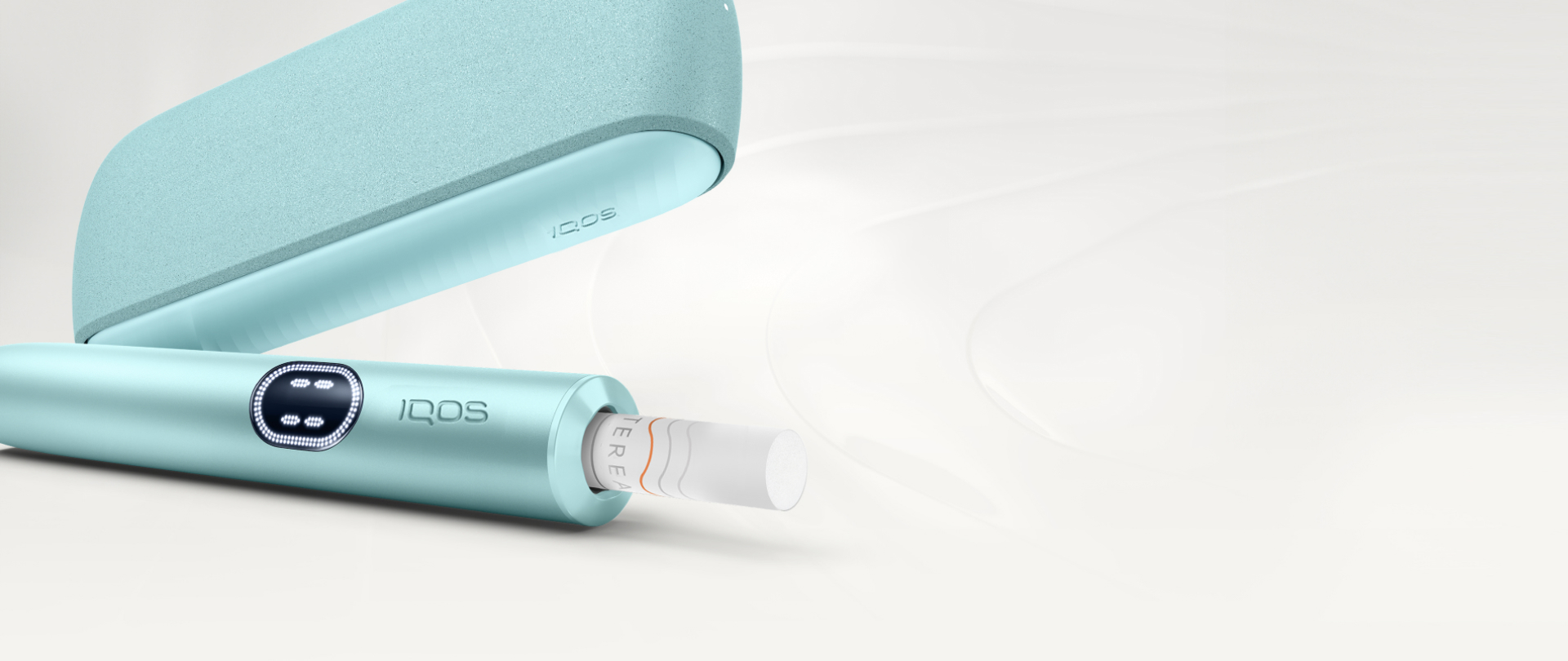 An IQOS ILUMA PRIME Holder with a TEREA stick inserted next to an IQOS ILUMA Pocket Charger.