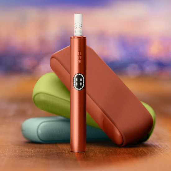 A Jade Green IQOS ILUMA PRIME Holder and Charger.