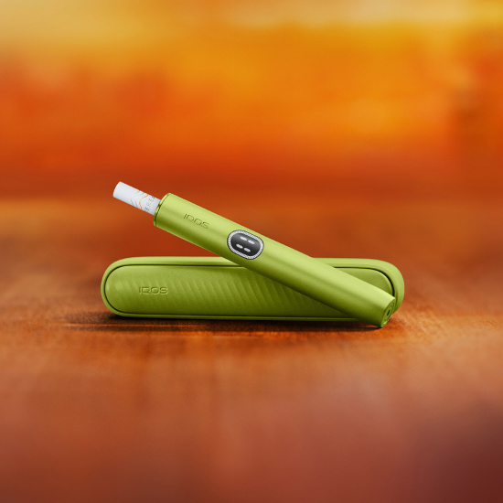 A Jade Green IQOS ILUMA PRIME Holder and Charger.