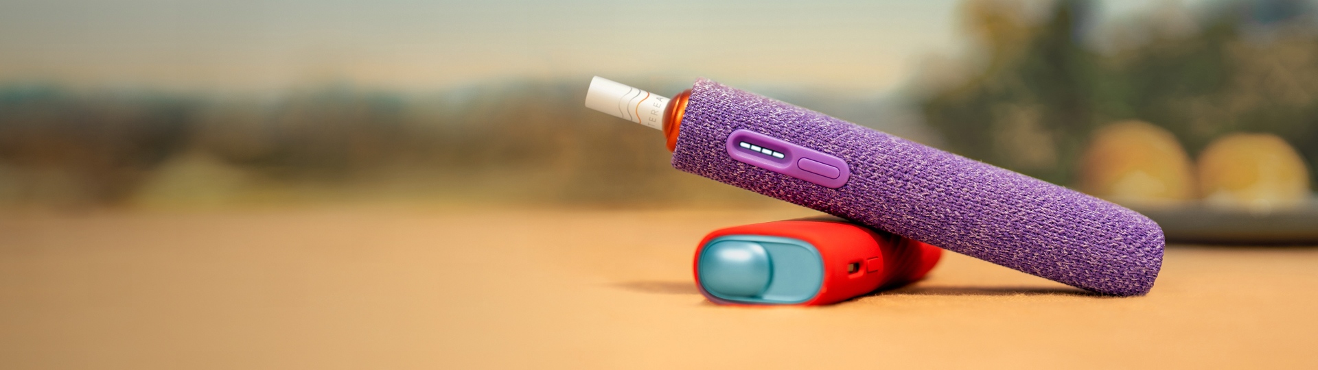 A Jade Green IQOS ILUMA PRIME Pocket Charger and Holder.