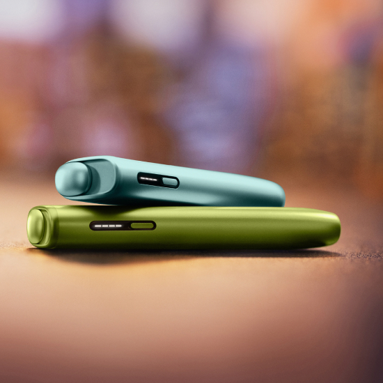 A Jade Green IQOS ILUMA PRIME Holder and Charger.