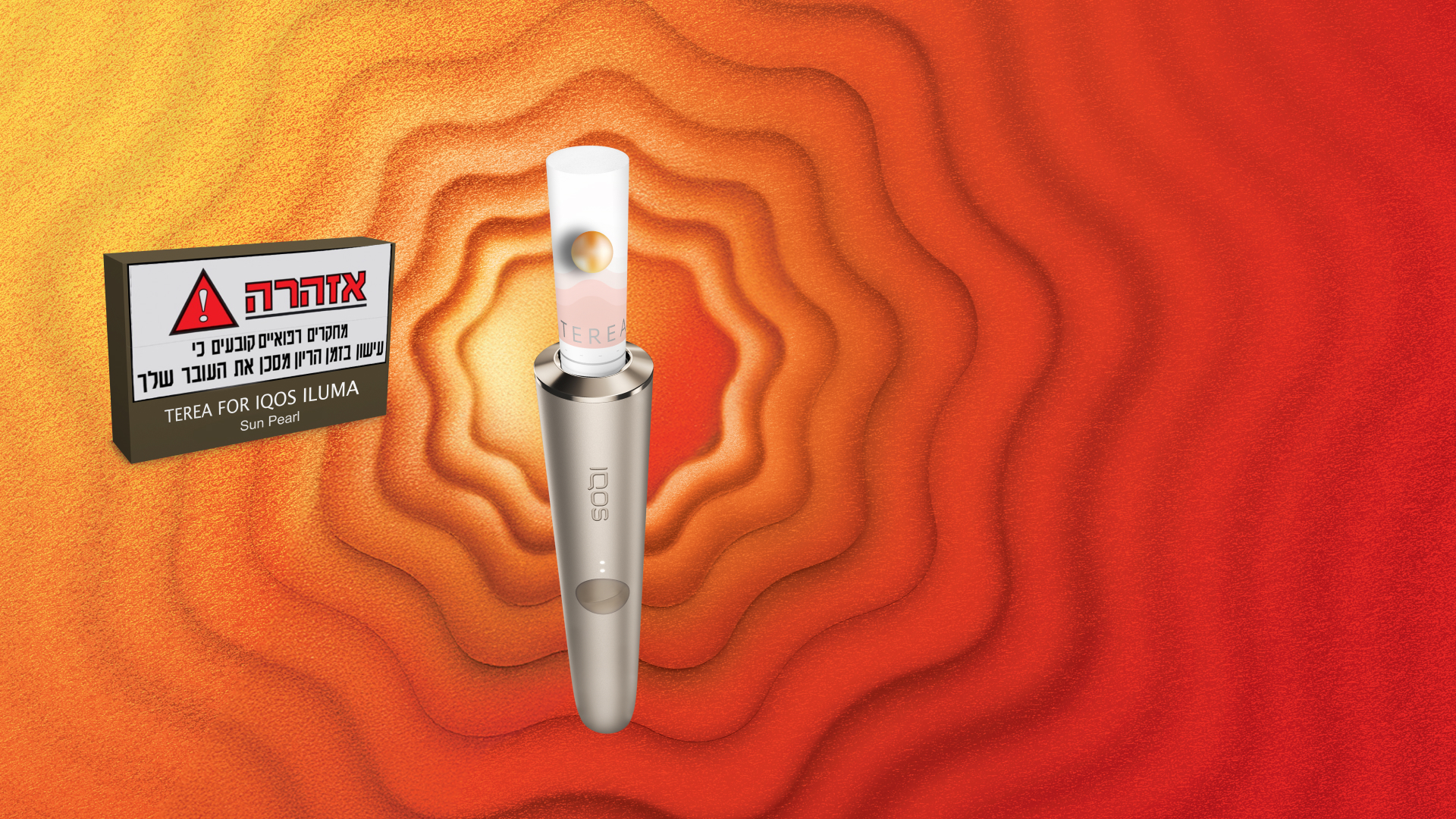 A gold IQOS device in a person's hand.