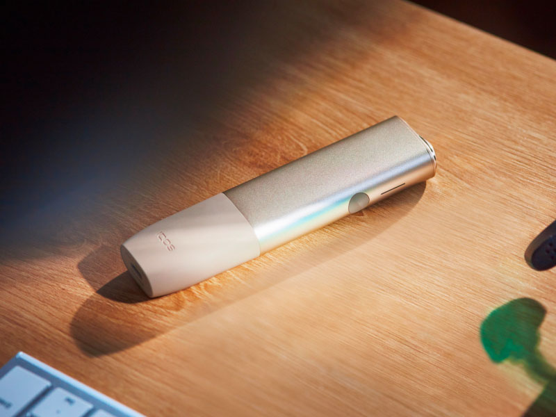 A close-up image of the IQOS ILUMA ONE device. 