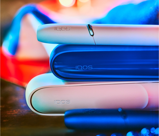 Blue and white IQOS devices