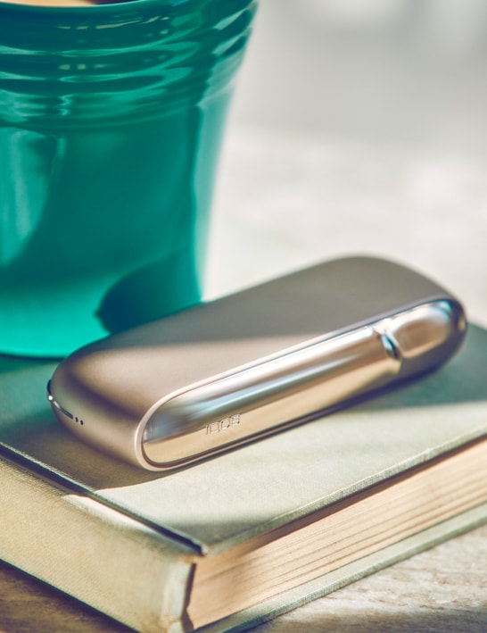 A gold IQOS device.