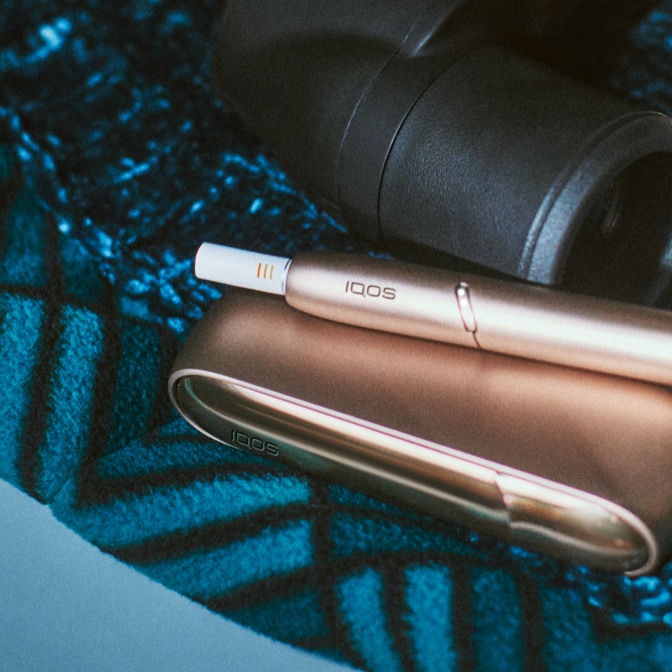 Two stellar blue and white IQOS  3 DUO holders and chargers